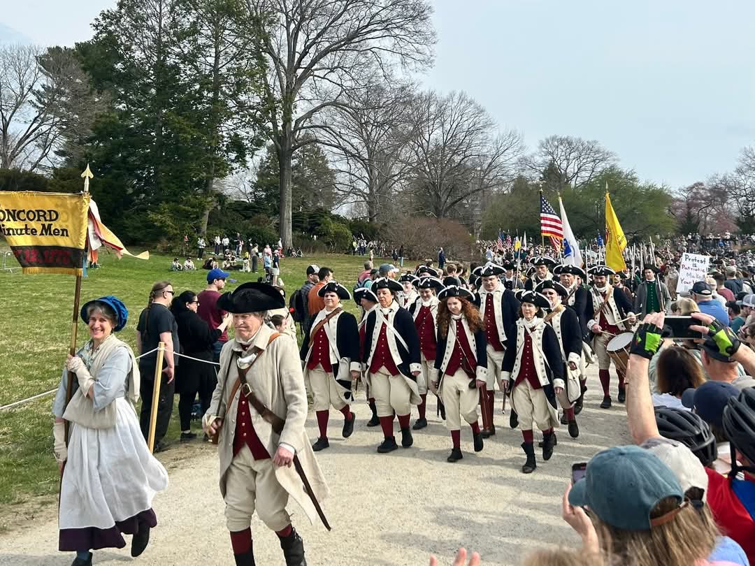 Concord Minutemen walk to the North Bridge in the 2025 Patriots Day Parade